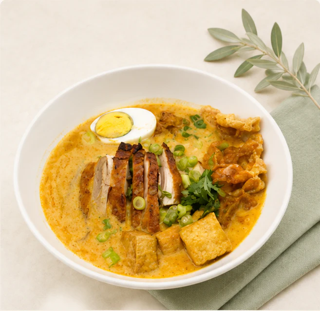 Southern-style Thai Curry Noodle Soup in a white bowl